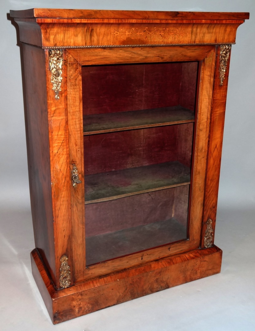 Appraisal: A thC walnut pier cabinet the rectangular overhanging top raised