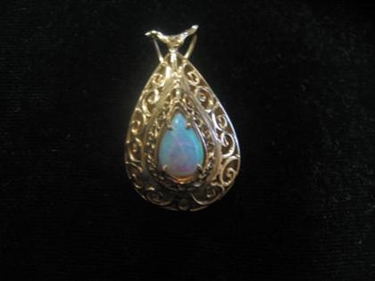 Appraisal: karat yellow gold and opal necklace enhancer Central pear shaped