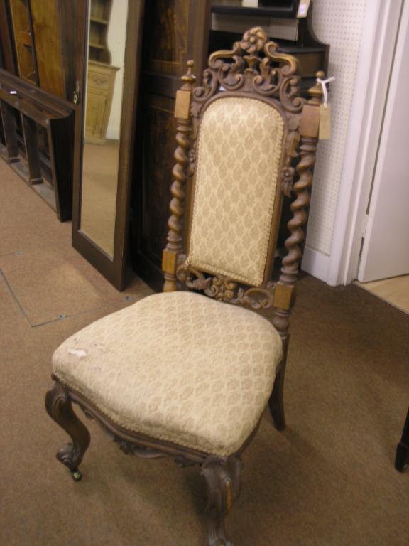 Appraisal: A Victorian walnut nursing chair with upholstered seat and back