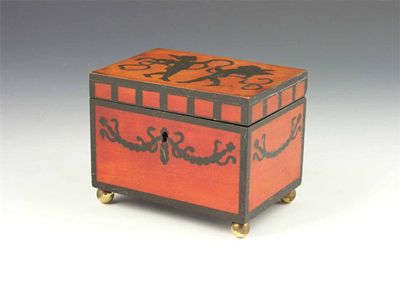 Appraisal: A continental stained fruitwood and ebonised decorated casket with a