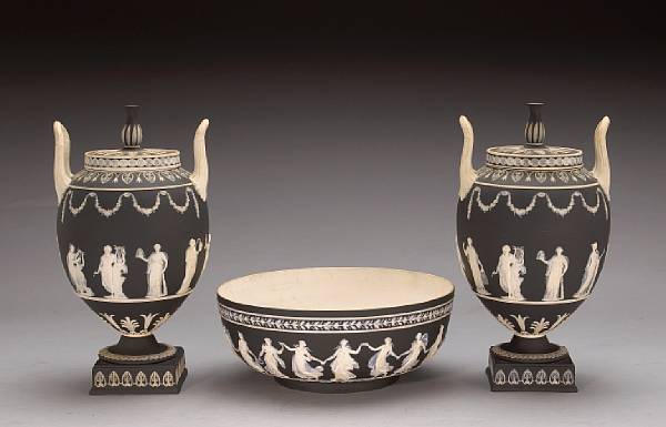 Appraisal: A pair of Wedgwood black basalt jasper covered urns and