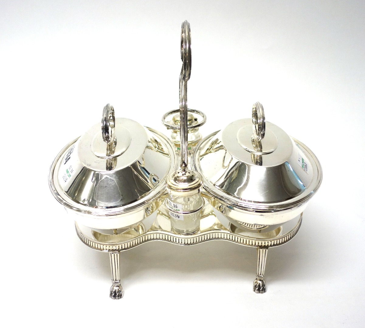 Appraisal: A plated breakfast serving dish stand with a loop shaped