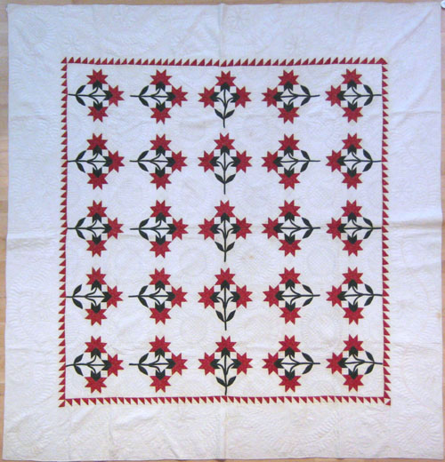 Appraisal: Pieced red and green calico quilt late th c with