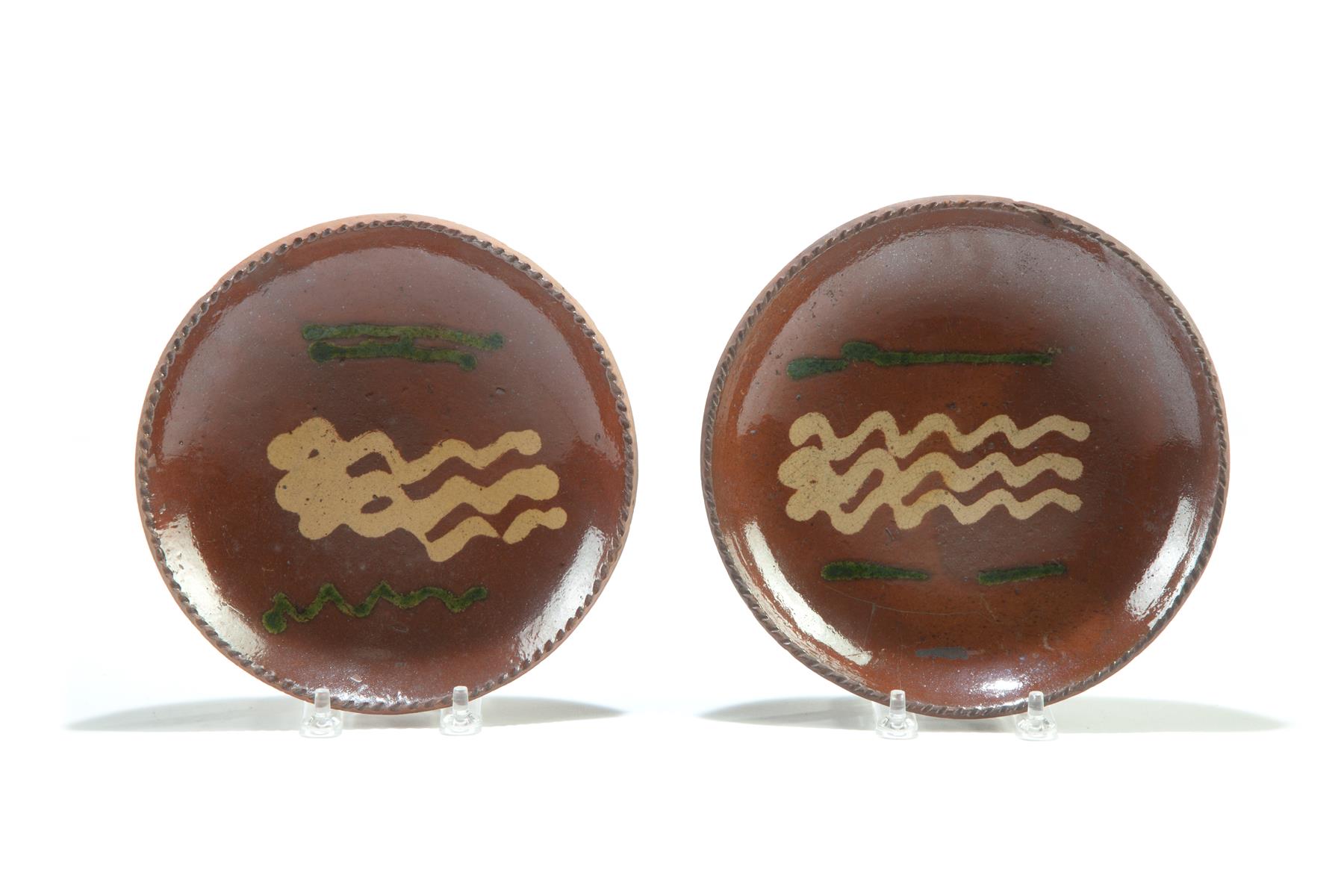 Appraisal: TWO AMERICAN REDWARE PIE PLATES Mid th century Coggled rims