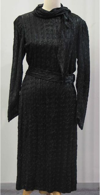 Appraisal: Dinner dress in black matlasse complete with belt and self