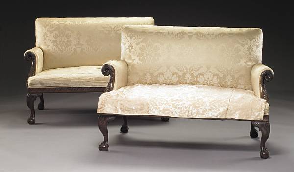 Appraisal: A pair of George II style carved mahogany settees first