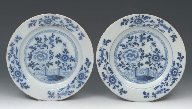 Appraisal: A PAIR OF ENGLISH DELFT WARE PLATES decorated with chrysanthemum