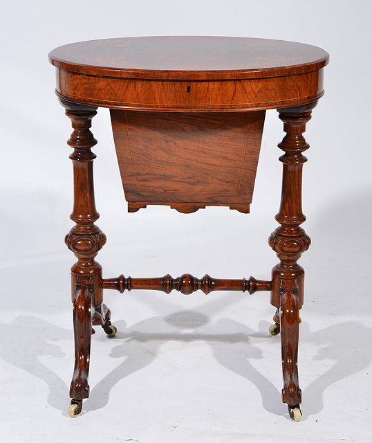 Appraisal: A VICTORIAN OVAL WALNUT WORK TABLE the burr veneered top