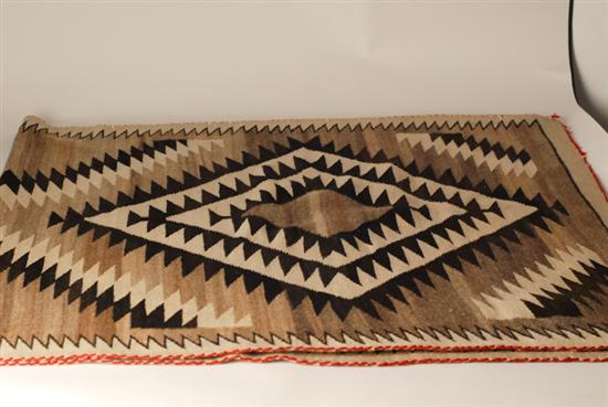 Appraisal: An E th C Navajo Rug a geometric design in