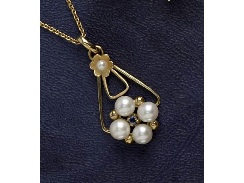 Appraisal: PEARL PENDANT k yellow gold pendant set with five white