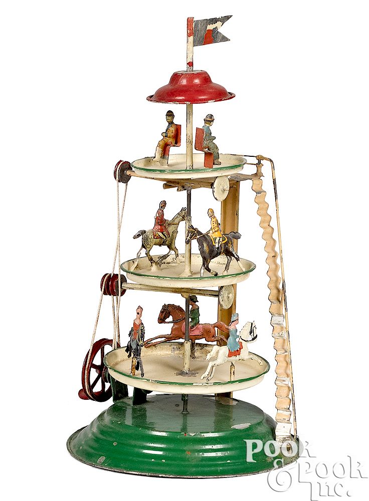 Appraisal: German painted tin three-tier steam toy carousel German painted tin