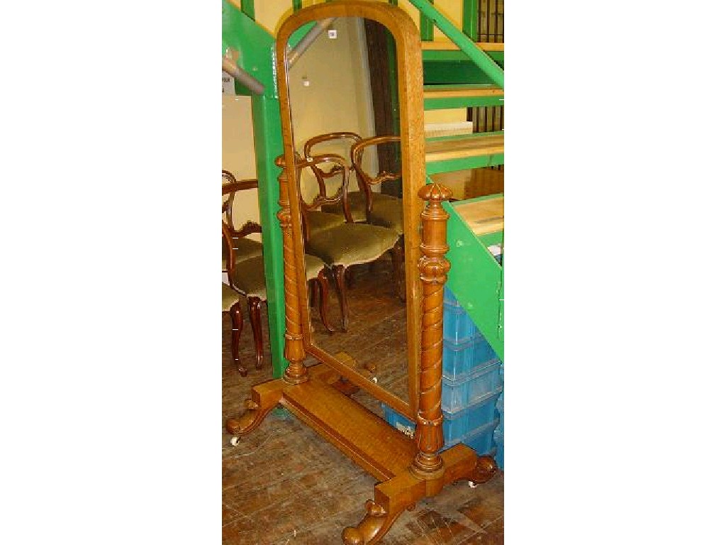 Appraisal: A Victorian light oak cheval glass mirror of arched form