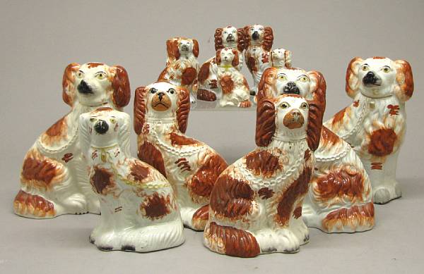 Appraisal: Twelve Staffordshire seated spaniels second half th century heights between