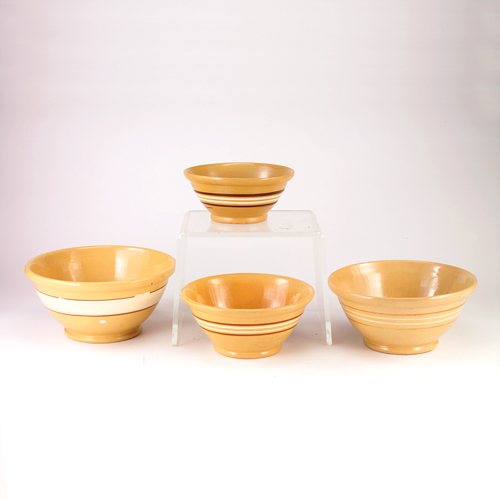 Appraisal: Yellow Ware four associated nesting bowls with a cream and