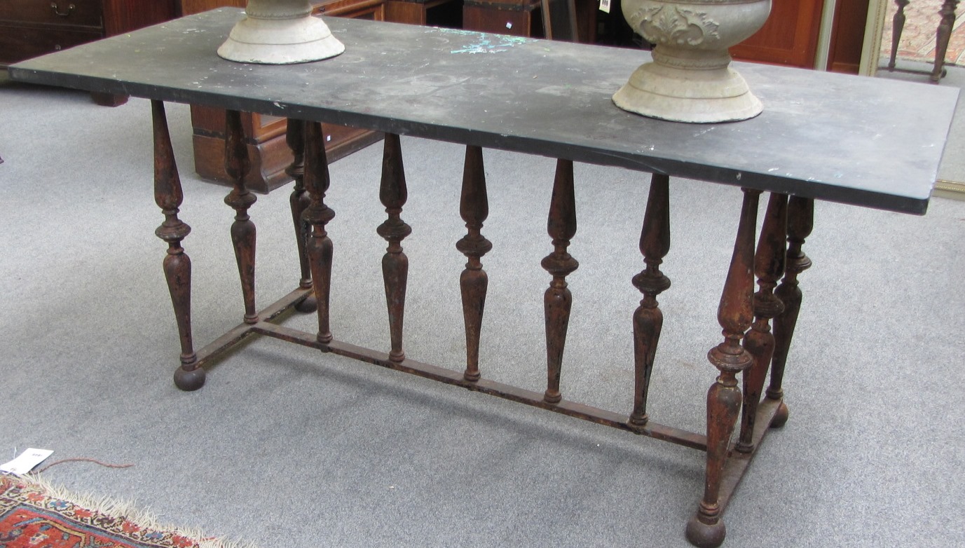 Appraisal: A th century slate top centre table on an baluster