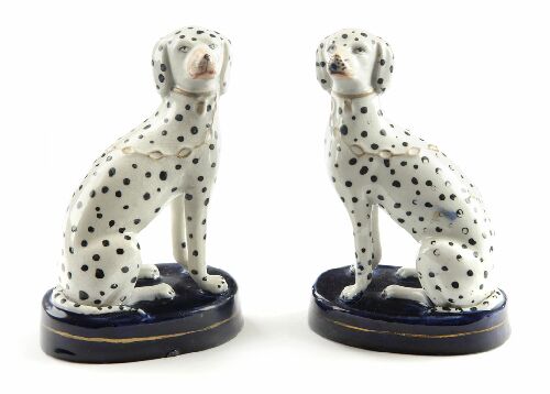 Appraisal: A pair of th century Staffordshire dalmations sitting on blue