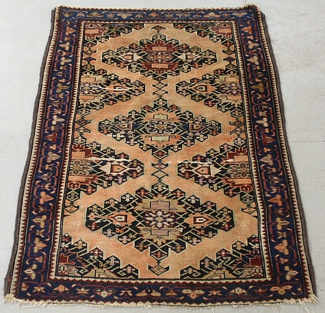 Appraisal: - Persian oriental mat with an orange field and three