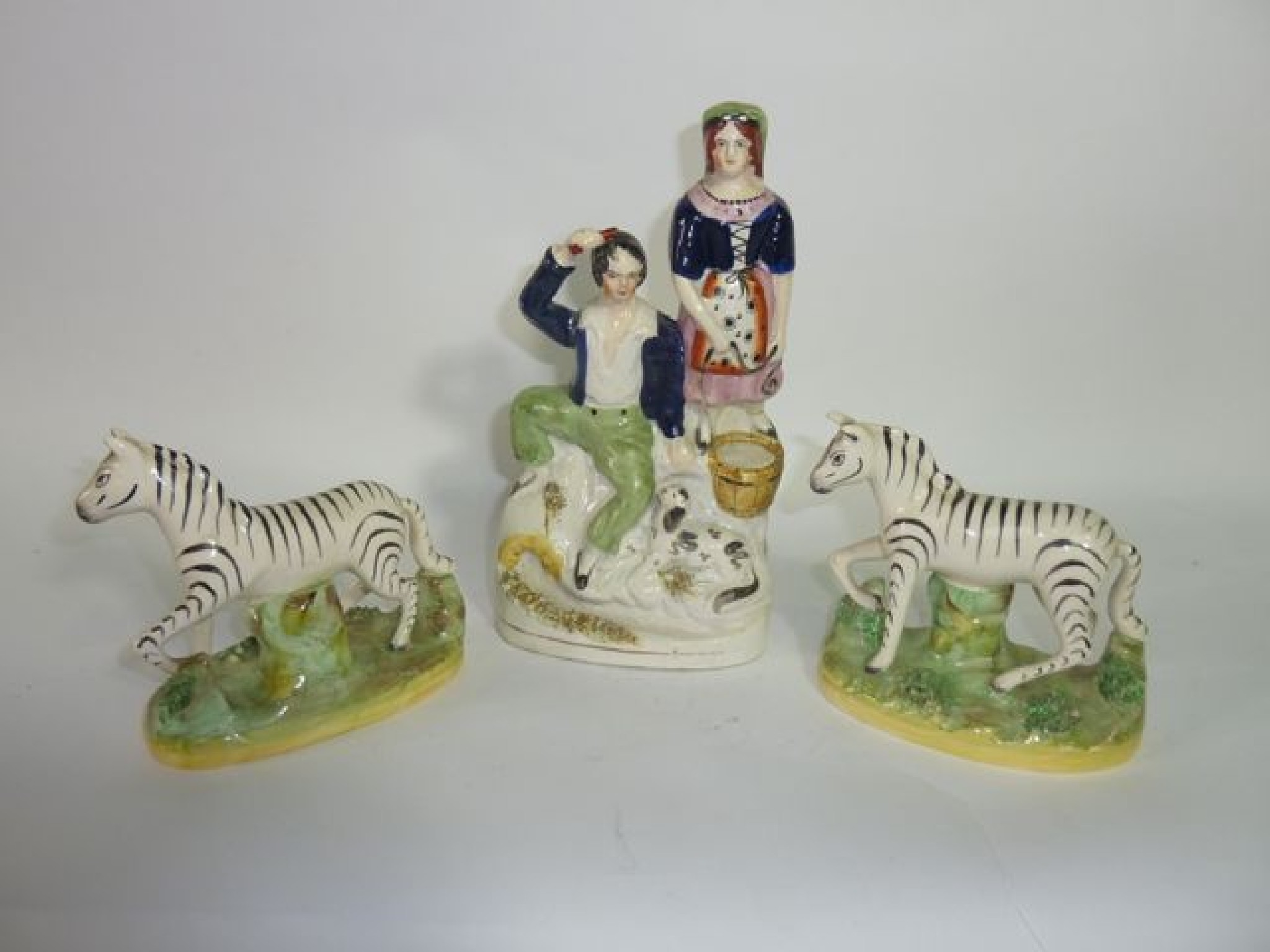 Appraisal: A pair of th century Staffordshire models of standing zebra