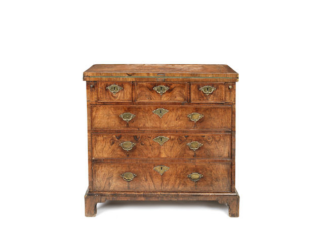 Appraisal: A George II walnut and featherbanded bachelor's chest the hinged