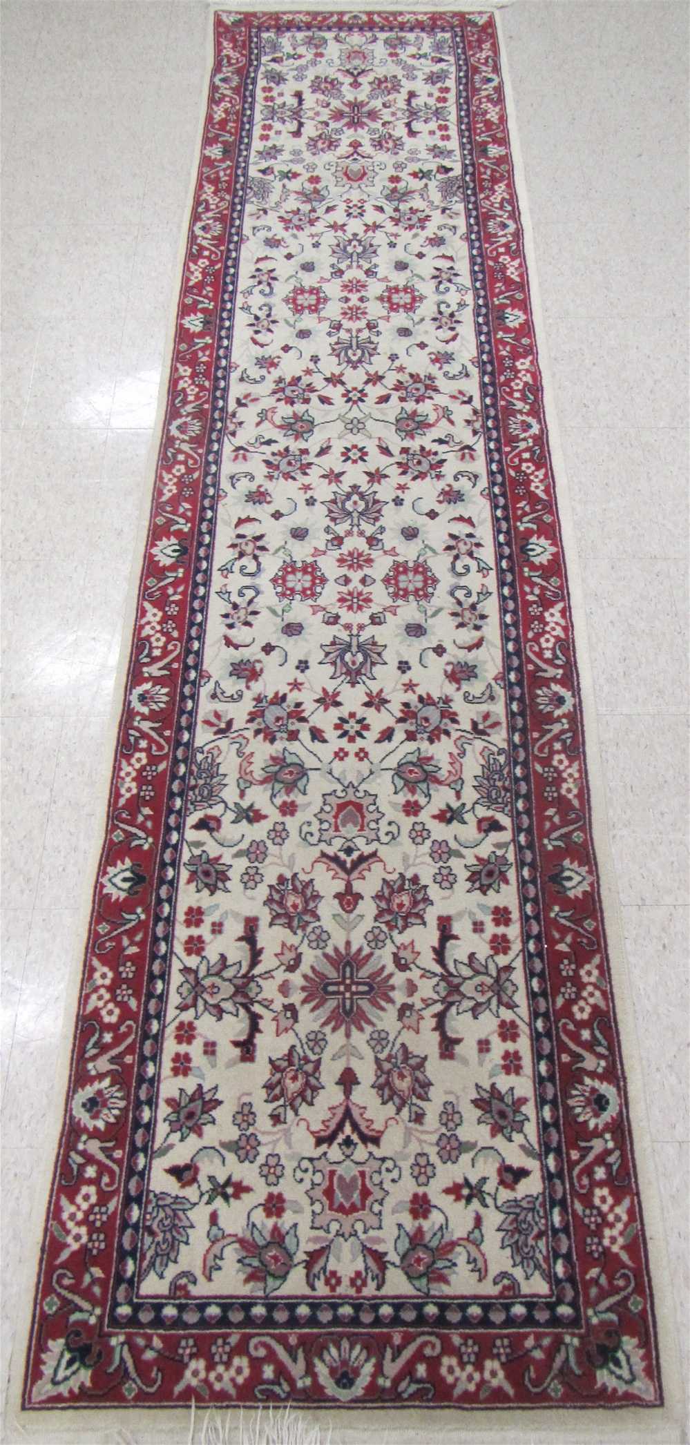 Appraisal: HAND KNOTTED ORIENTAL RUNNER Pakistani-Persian overall floral design on cream