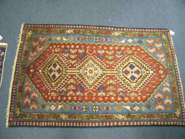 Appraisal: Shiraz Persian Handmade Rug triple medallion on red field with