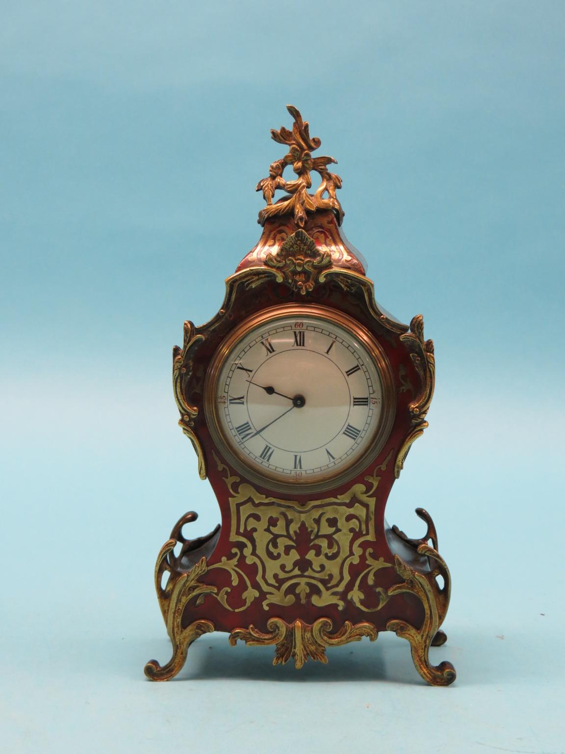 Appraisal: A French boullework mantel clock rococo-shape with convex enamelled dial