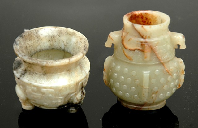 Appraisal: TWO CHINESE ARCHAISTIC JADE VASES th th century The first