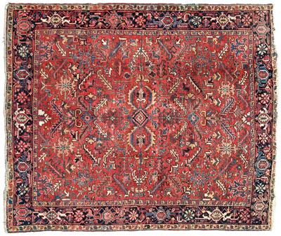 Appraisal: Heriz rug repeating designs on brick red field blue and