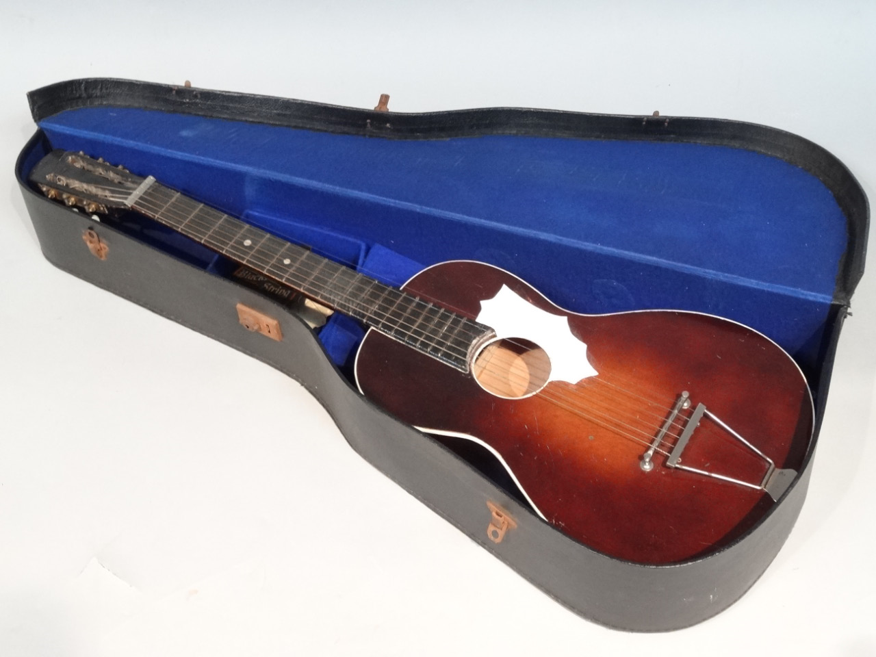 Appraisal: A mid- thC acoustic guitar wooden carcass and metal tuning