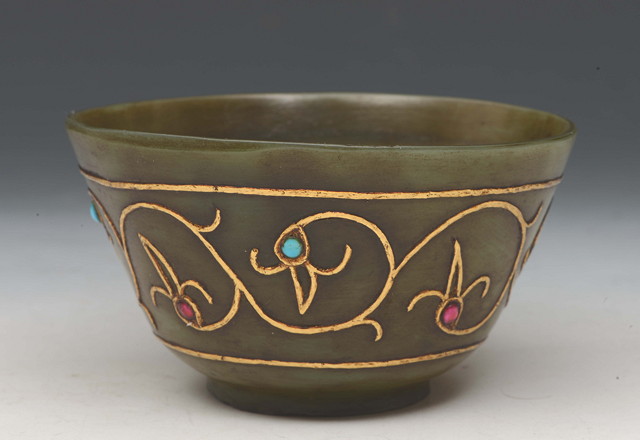 Appraisal: AN INDIAN GREEN NEPHRITE CIRCULAR BOWL with raised gold metal