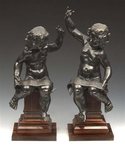 Appraisal: A PAIR OF FRENCH ROCOCO BRONZE CHERUBS each holding a