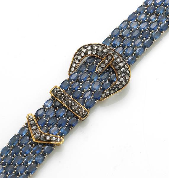 Appraisal: A sapphire diamond silver-topped k gold and gold-plated buckle motif