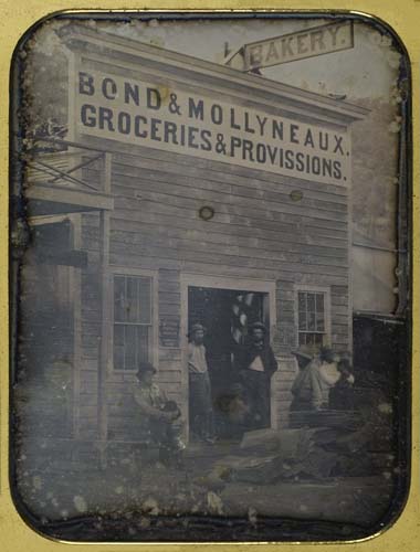 Appraisal: CASED IMAGE Whole-plate daguerreotype depicting Bond Mollyneaux Groceries and Provissions