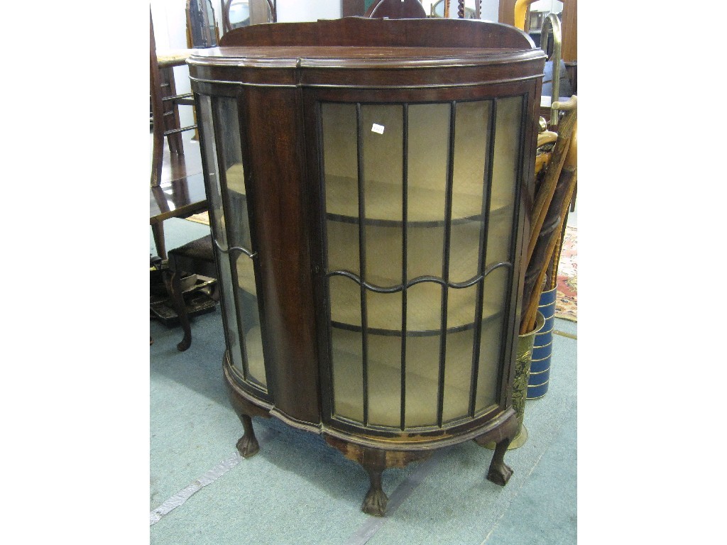 Appraisal: Bow fronted display cabinet on ball and claw feet