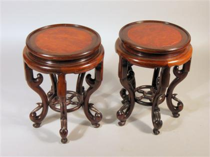 Appraisal: Pair of Chinese hardwood and burlwood insert stands The circular