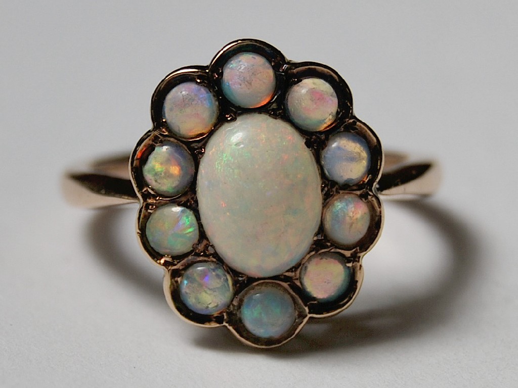 Appraisal: Opal cluster ring in yellow metal setting stamped ct