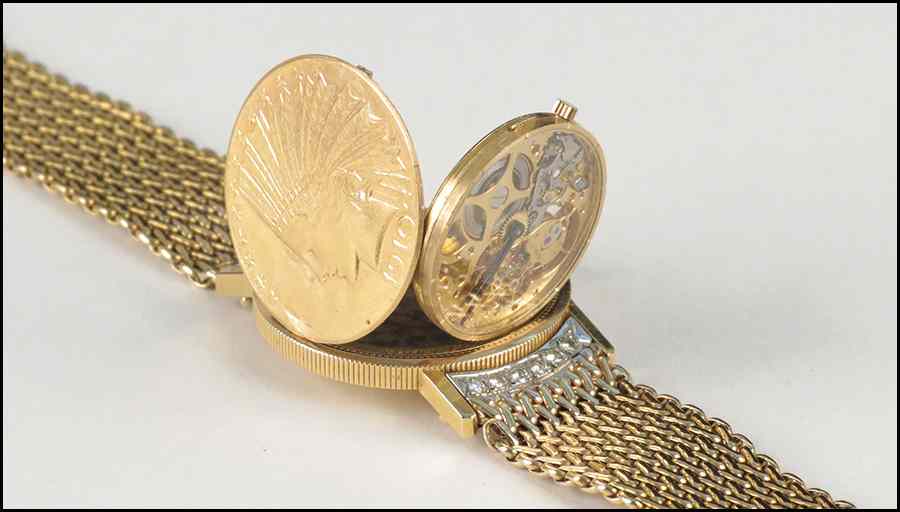 Appraisal: ULLMAN KARAT YELLOW GOLD AND DIAMOND 'SURPRISE' WATCH M and