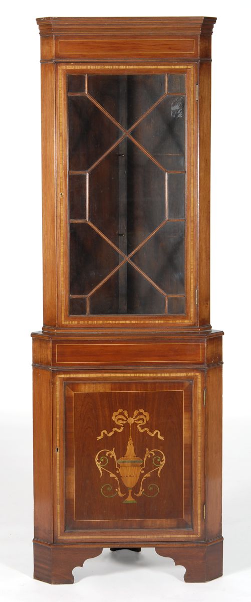 Appraisal: ONE-PIECE CORNER CUPBOARD IN THE TH CENTURY STYLE Late th