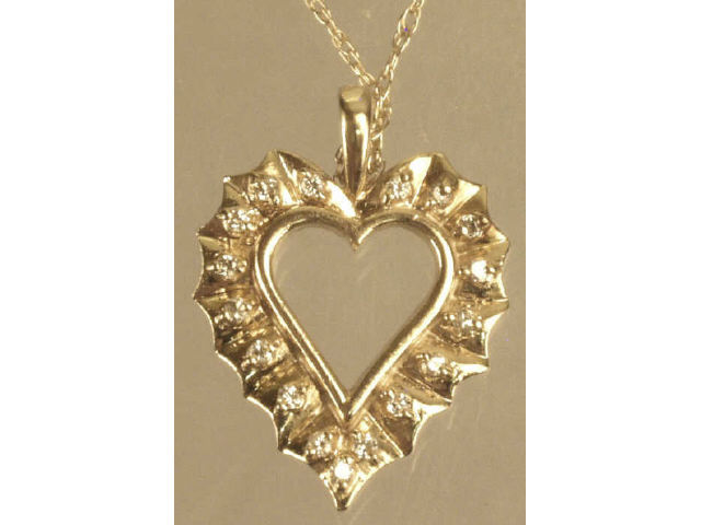 Appraisal: Ladies karat yellow gold heart design pendant set with approx