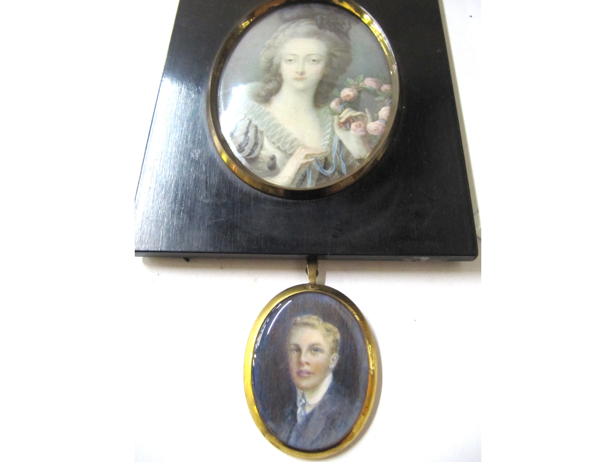 Appraisal: A lot comprising two portrait miniatures - a Georgian lady