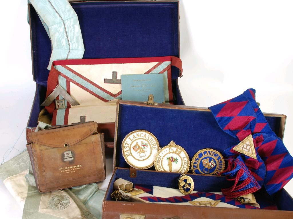 Appraisal: TWO BROWN LEATHER CASES CONTAINING FIRST LANCASHIRE MASONIC LODGE APRONS