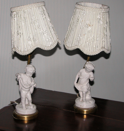 Appraisal: Pair of White Ceramic Cupid Figural Boudoir Lamps th Century