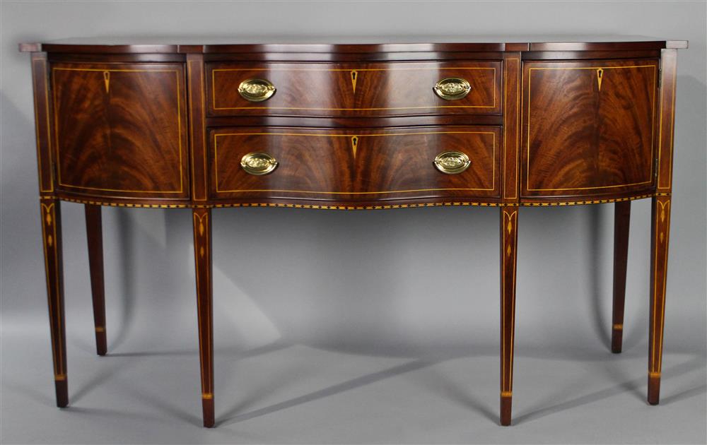 Appraisal: HENKEL HARRIS MAHOGANY SERPENTINE HEPPLEWHITE STYLE SIDEBOARD WITH BELLFLOWER AND