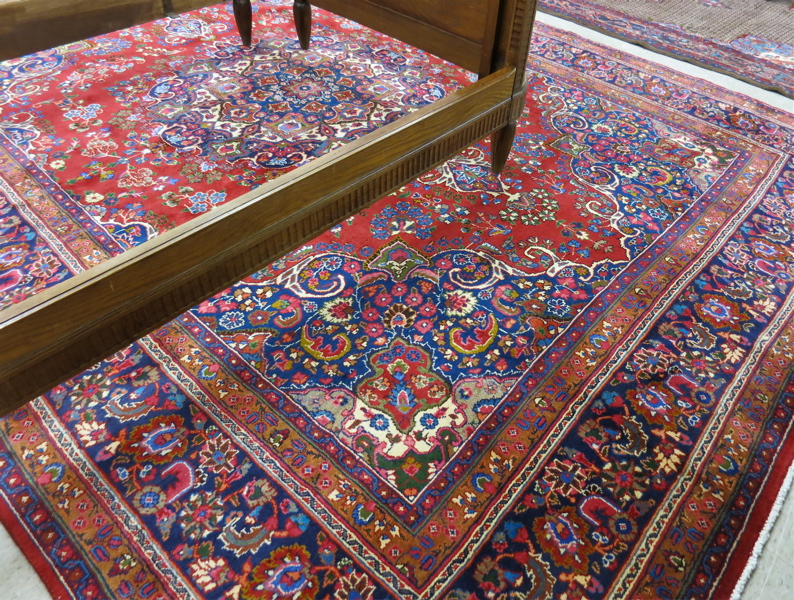 Appraisal: HAND KNOTTED PERSIAN CARPET floral and central floral medallion design