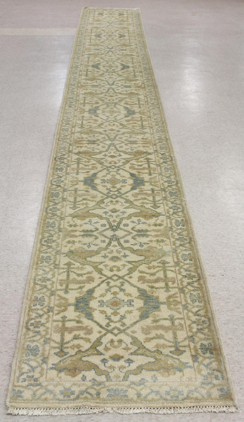 Appraisal: HAND KNOTTED ORIENTAL RUNNER Indo-Persian stylized floral tracery on cream