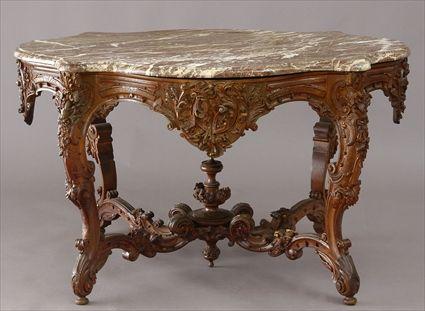 Appraisal: LOUIS XV-STYLE CARVED WALNUT CENTER TABLE The veined pink marble