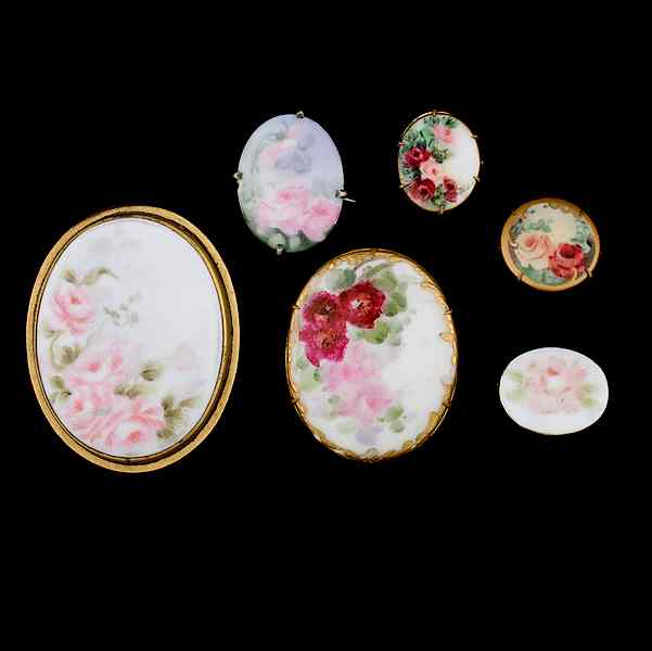 Appraisal: Painted Porcelain brooches A grouping of six painted brooches all