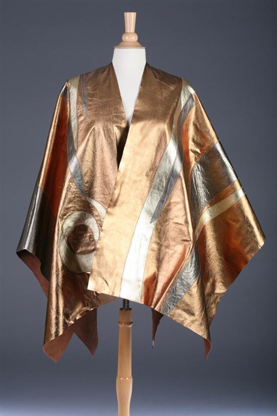 Appraisal: LADY'S GOLD SILVER AND BRONZE PATCHWORK LEATHER PONCHO Circa s