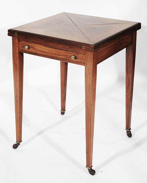 Appraisal: A VICTORIAN ROSEWOOD INVERTED CARD TABLE top with boxwood stringing