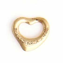 Appraisal: An ct gold heart shaped charm by Tiffany Co width